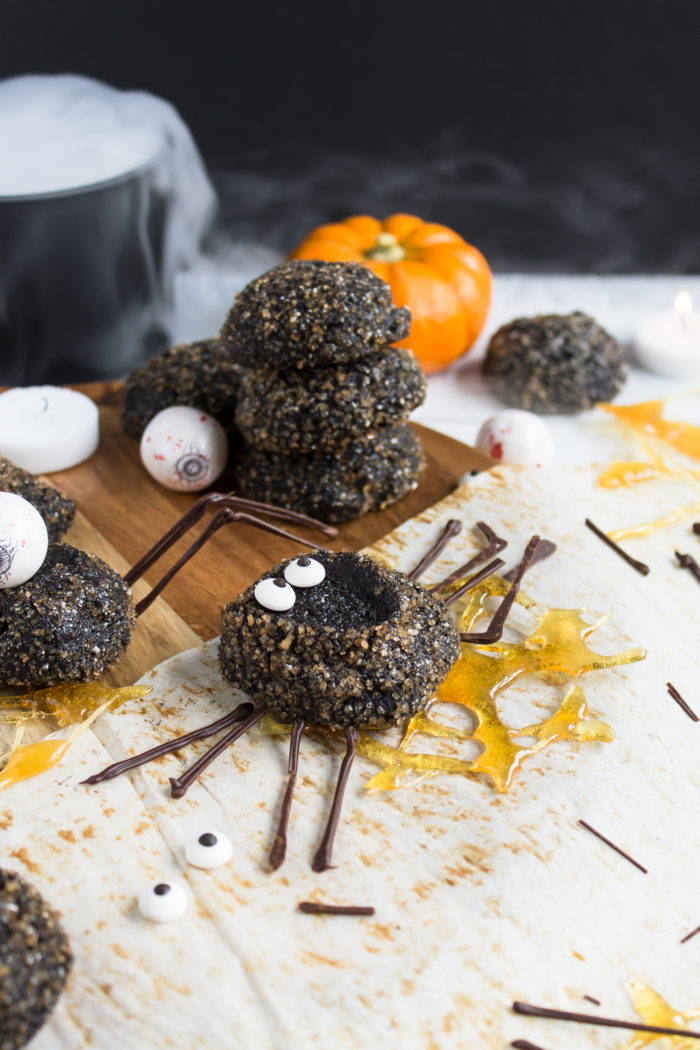 chocolate thumbprint cookie spiders with caramel spider webs