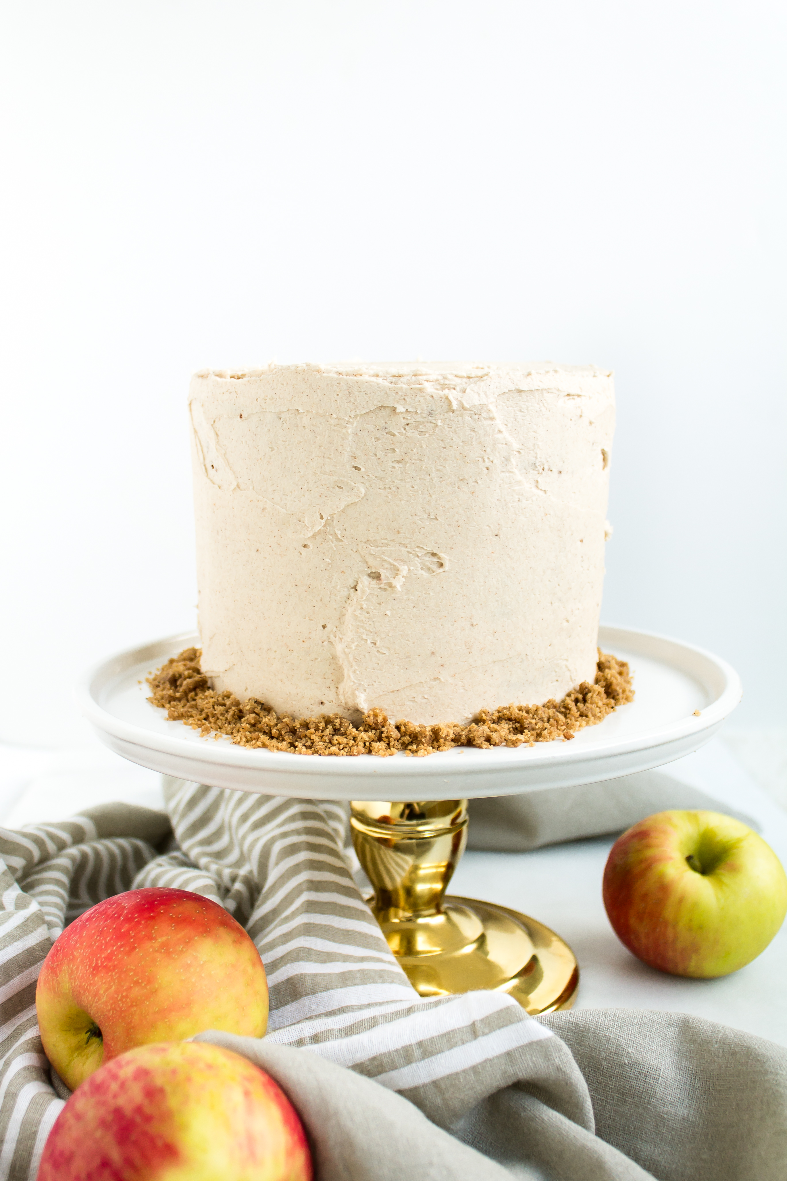 Apple cake with brown butter crumble and cinnamon frosting is a delicious treat and a crowd-pleasing dessert for all of your fall gatherings. | www.passthecookies.com
