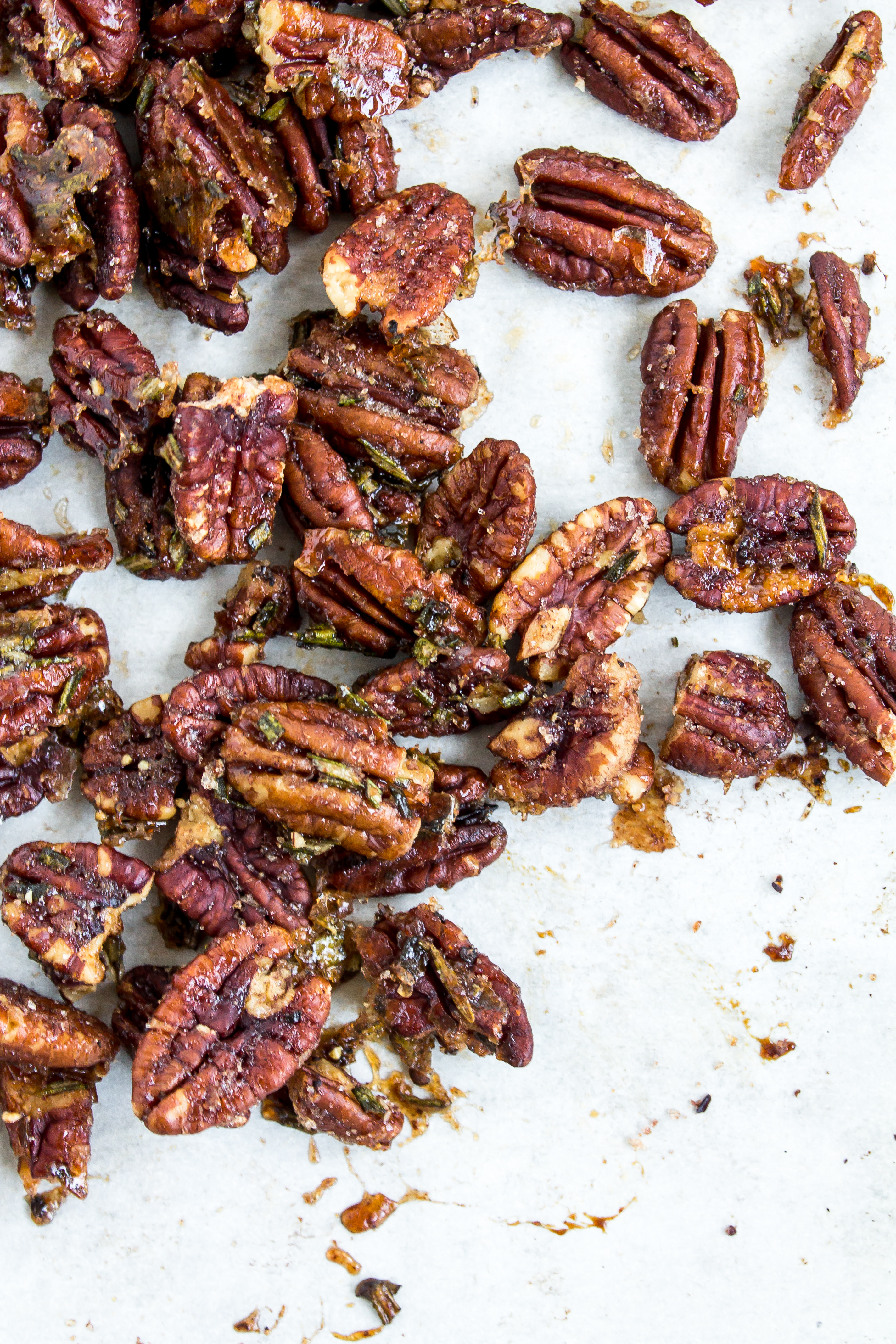 Rosemary spiced pecans are the perfect sweet and salty snack for your appetizer board. With their deliciously addictive flavor, everyone will ask you for this recipe. | Pass the Cookies | www.passthecookies.com