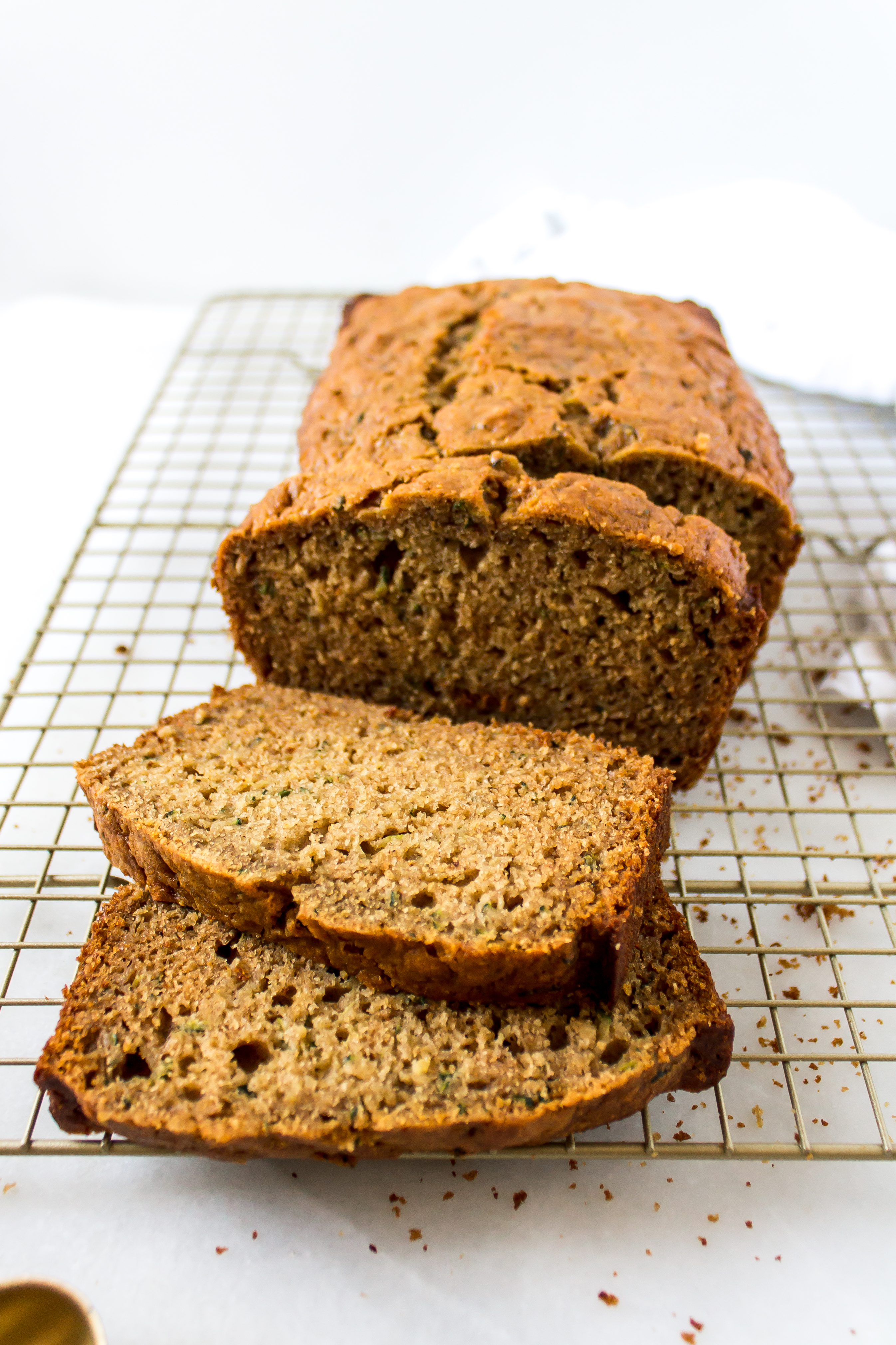 One-bowl healthy zucchini bread is an easy breakfast or afternoon treat. By the taste, you would never know it is filled with veggies! | Pass the Cookies | www.passthecookies.com