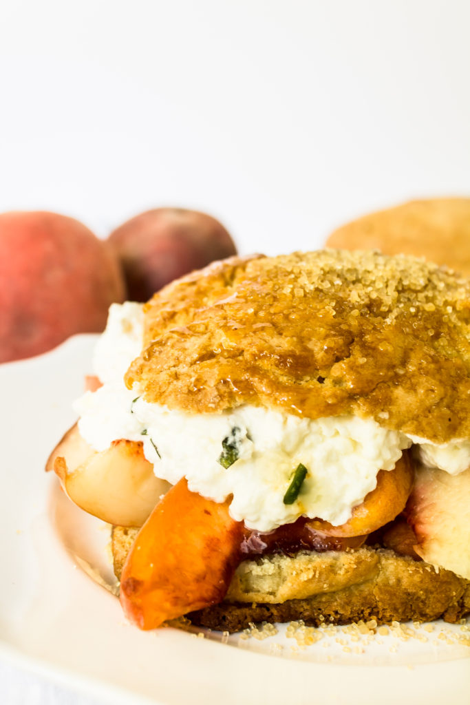 Brown sugar peach shortcake with basil whipped cream are the perfect fresh summer treat and a beautiful way to use up those sweet farmer's market peaches.