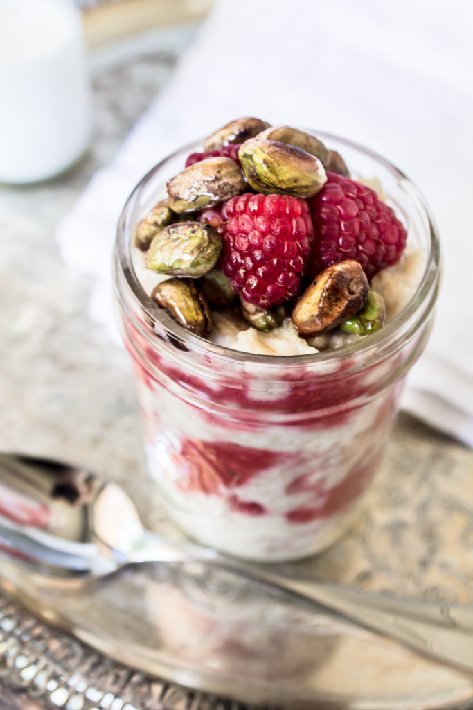 This creamy porridge with raspberry ripple and honey toasted pistachios is a delicious, nutritious way to start your morning.