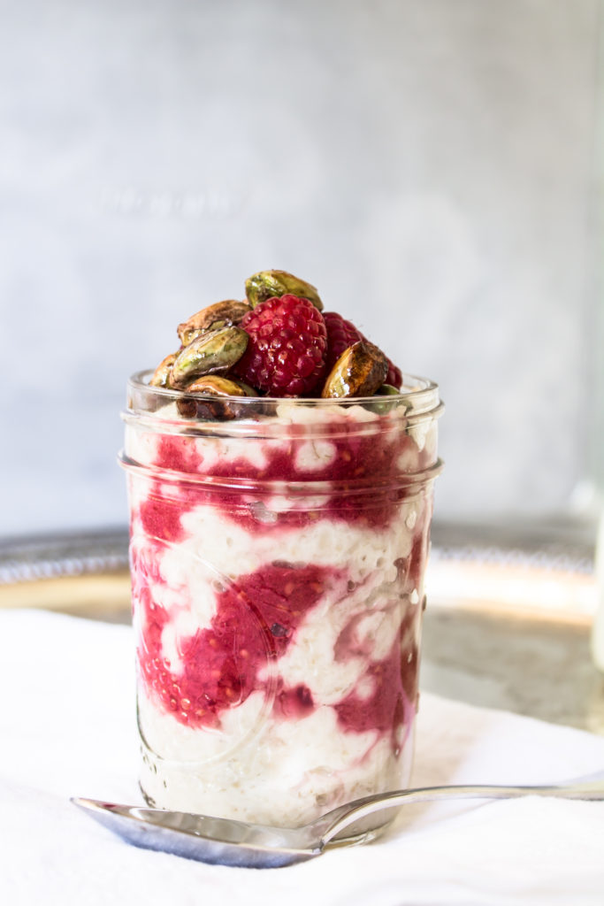 This creamy porridge with raspberry ripple and honey toasted pistachios is a delicious, nutritious way to start your morning.