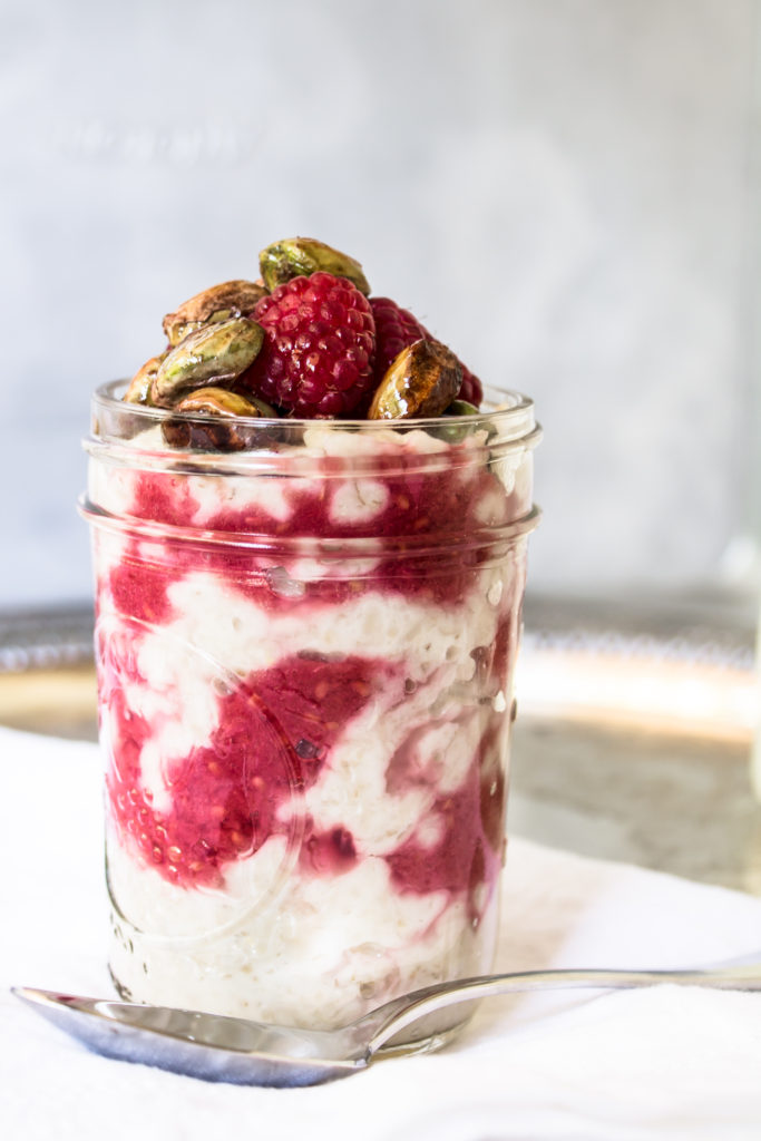 This creamy porridge with raspberry ripple and honey toasted pistachios is a delicious, nutritious way to start your morning.