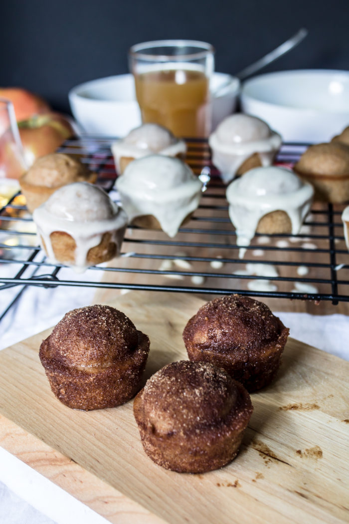 apple cider doughnut muffins with cinnamon sugar, maple whiskey glaze, and apple cider glaze