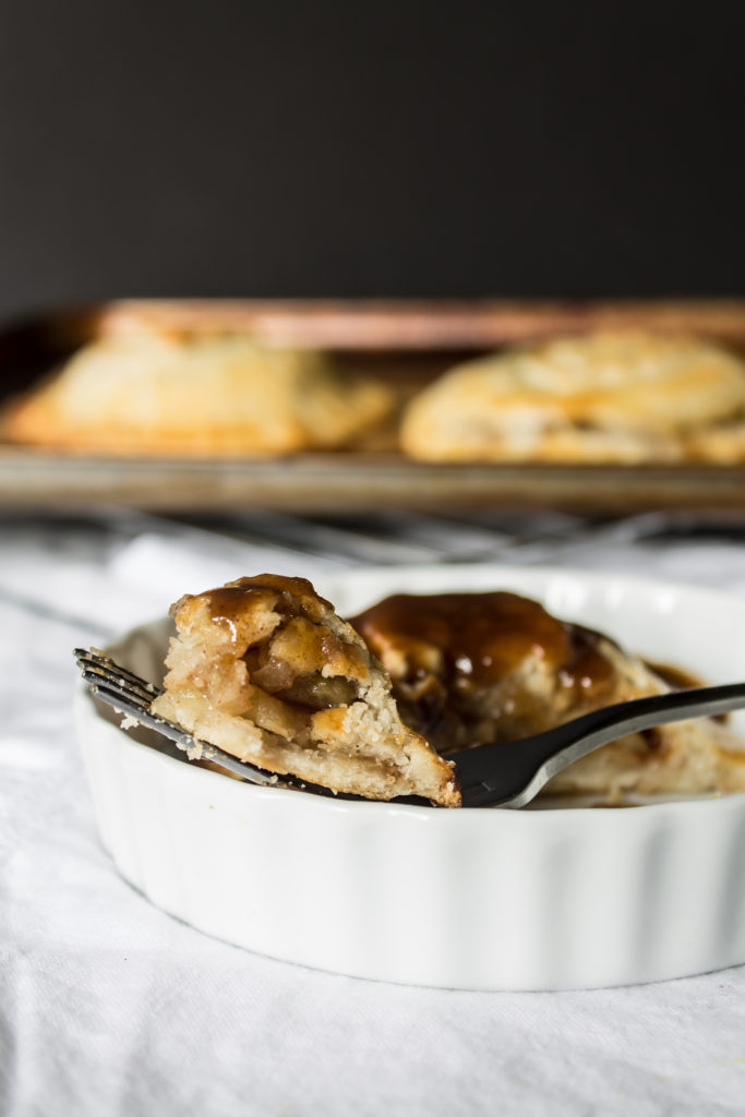 These apple hand pies with bourbon sauce are delicious enough to feed a crowd and easy enough to make on Thanksgiving day!  (Don't worry, they can be made ahead of time too)  www.passthecookies.com