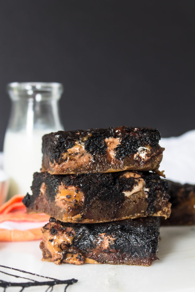 These brown butter blondie dark chocolate brownie candy swirled bars are rich, delicious and melty.  They are the perfect way to use up your leftover Halloween candy and welcome November!
