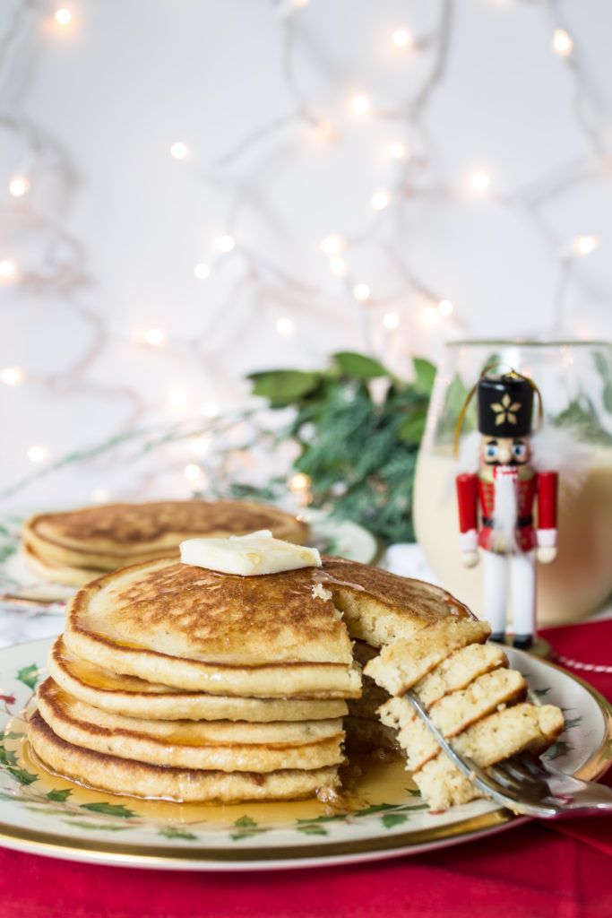 Swing in the Christmas season with these easy, fluffy, delicious eggnog pancakes and some nutmeg to top!  www.passthecookies.com