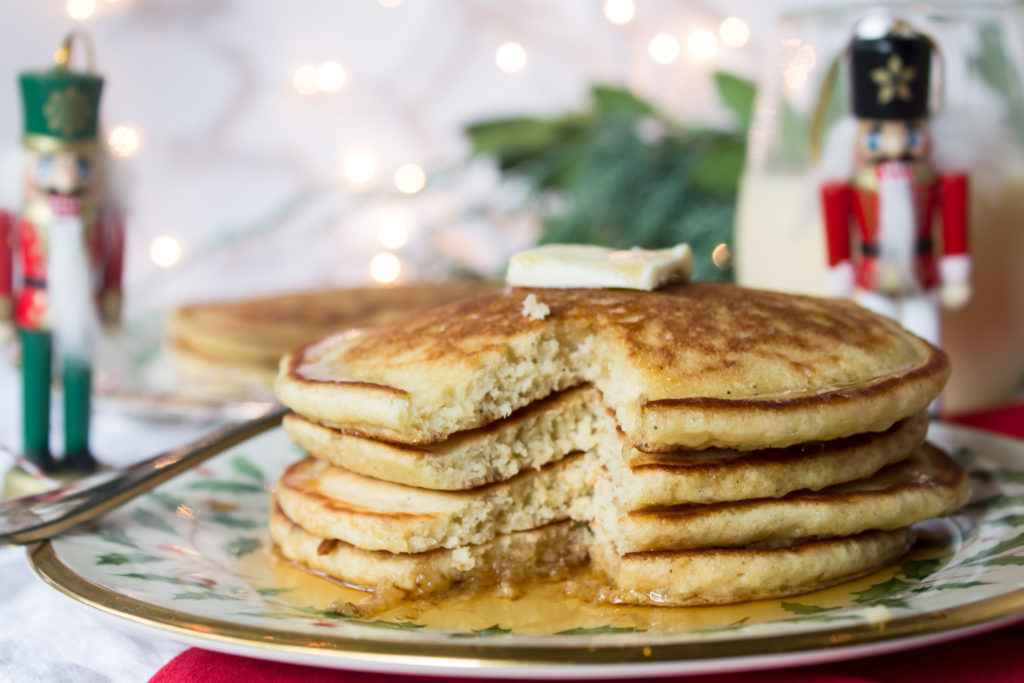 Swing in the Christmas season with these easy, fluffy, delicious eggnog pancakes and some nutmeg to top!  www.passthecookies.com