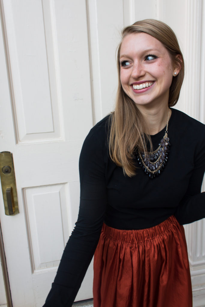 Pairing a simple black top with a fun burnt orange maxi skirt a statement necklace, and classic leopard flats is an easy way to create a great Halloween or fall outfit.  www.passthecookies.com