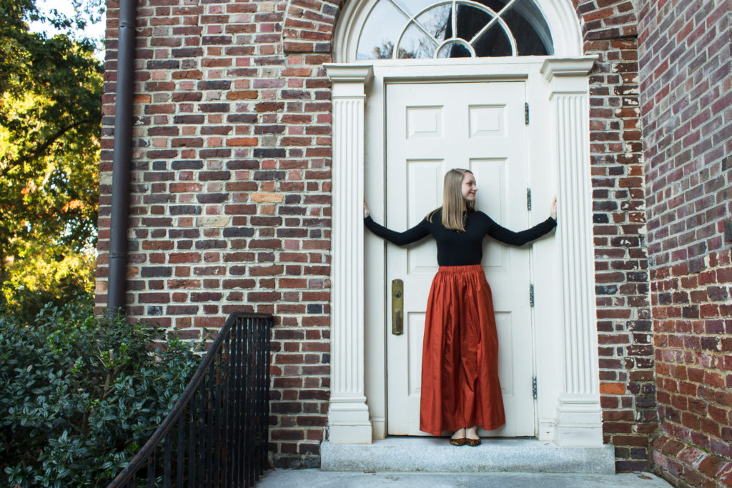 Pairing a simple black top with a fun burnt orange maxi skirt a statement necklace, and classic leopard flats is an easy way to create a great Halloween or fall outfit.  www.passthecookies.com