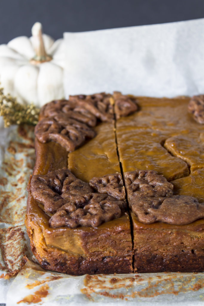 With the perfect flavors of fall, these pumpkin pie bars with chocolate chip gingerbread crust and cinnamon whipped cream are the perfect addition to your Thanksgiving table.  www.passthecookies.com