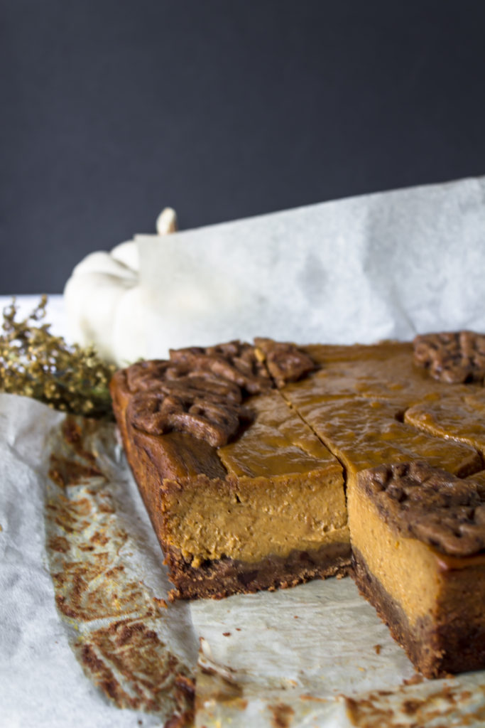 With the perfect flavors of fall, these pumpkin pie bars with chocolate chip gingerbread crust and cinnamon whipped cream are the perfect addition to your Thanksgiving table.  www.passthecookies.com