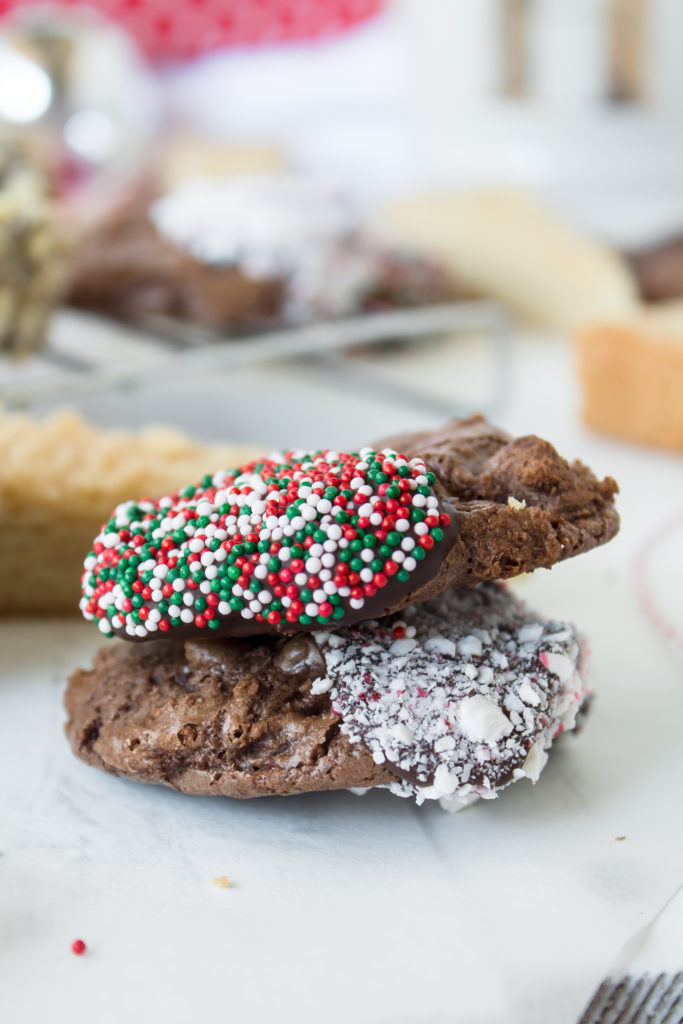Making Christmas cookies is one of my favorite holiday traditions.  These chocolate dipped shortbread and brownie cookies are sure to be hits at your holiday parties.  www.passthecookies.com