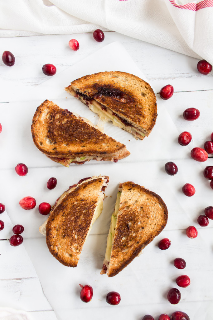 Filled with turkey, sweet cranberry sauce, tart apple slices, dijon, and gruyere, this Thanksgiving leftovers grilled cheese is easy, delicious and perfect for your day-after lunch. | Pass the Cookies | www.passthecookies.com