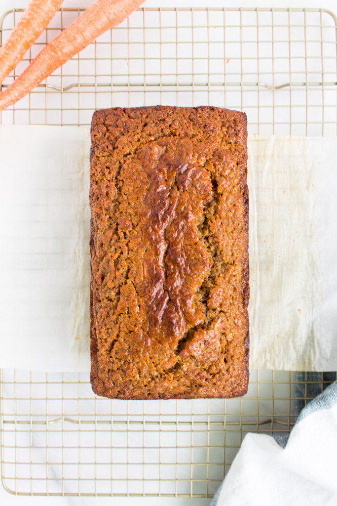 This healthier carrot cake banana bread is the perfect cross between indulgent carrot cake and moist, delicious familiar banana bread and makes a great spring breakfast or snack. | Pass the Cookies | www.passthecookies.com