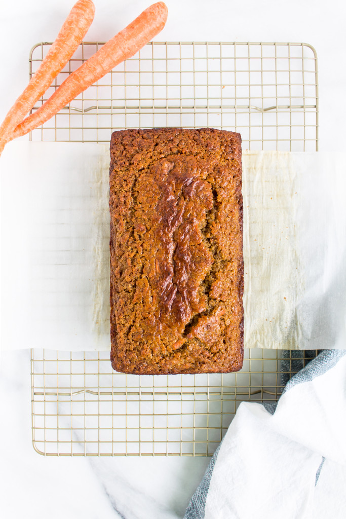 This healthier carrot cake banana bread is the perfect cross between indulgent carrot cake and moist, delicious familiar banana bread and makes a great spring breakfast or snack. | Pass the Cookies | www.passthecookies.com