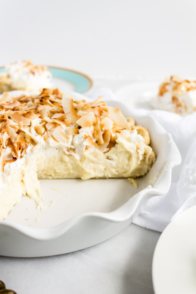 This classic coconut cream pie has a perfectly flaky crust, rich, coconut pastry cream filling, fluffy homemade whipped cream, golden-toasted coconut, and a side of good 'ol nostalgia. | Pass the Cookies | www.passthecookies.com