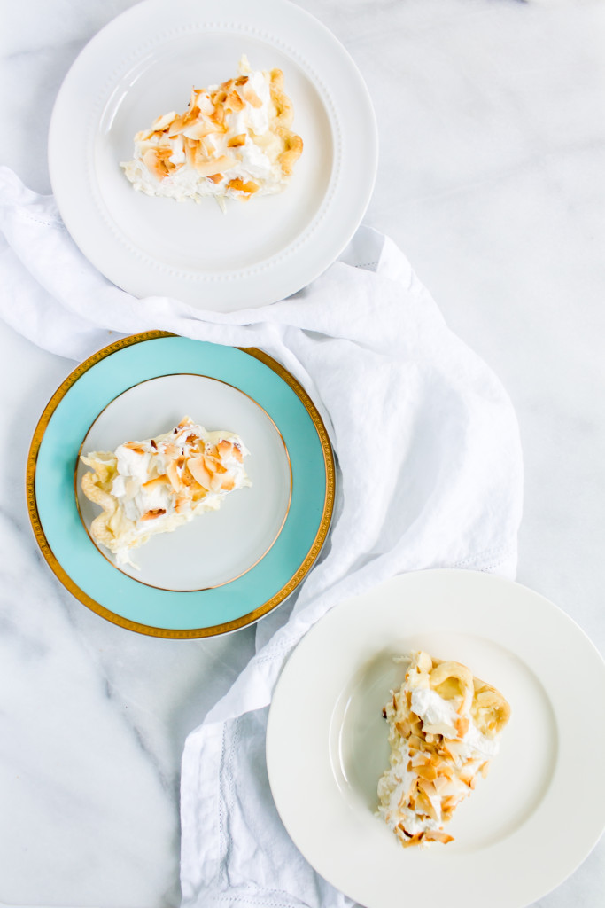 This classic coconut cream pie has a perfectly flaky crust, rich, coconut pastry cream filling, fluffy homemade whipped cream, golden-toasted coconut, and a side of good 'ol nostalgia. | Pass the Cookies | www.passthecookies.com