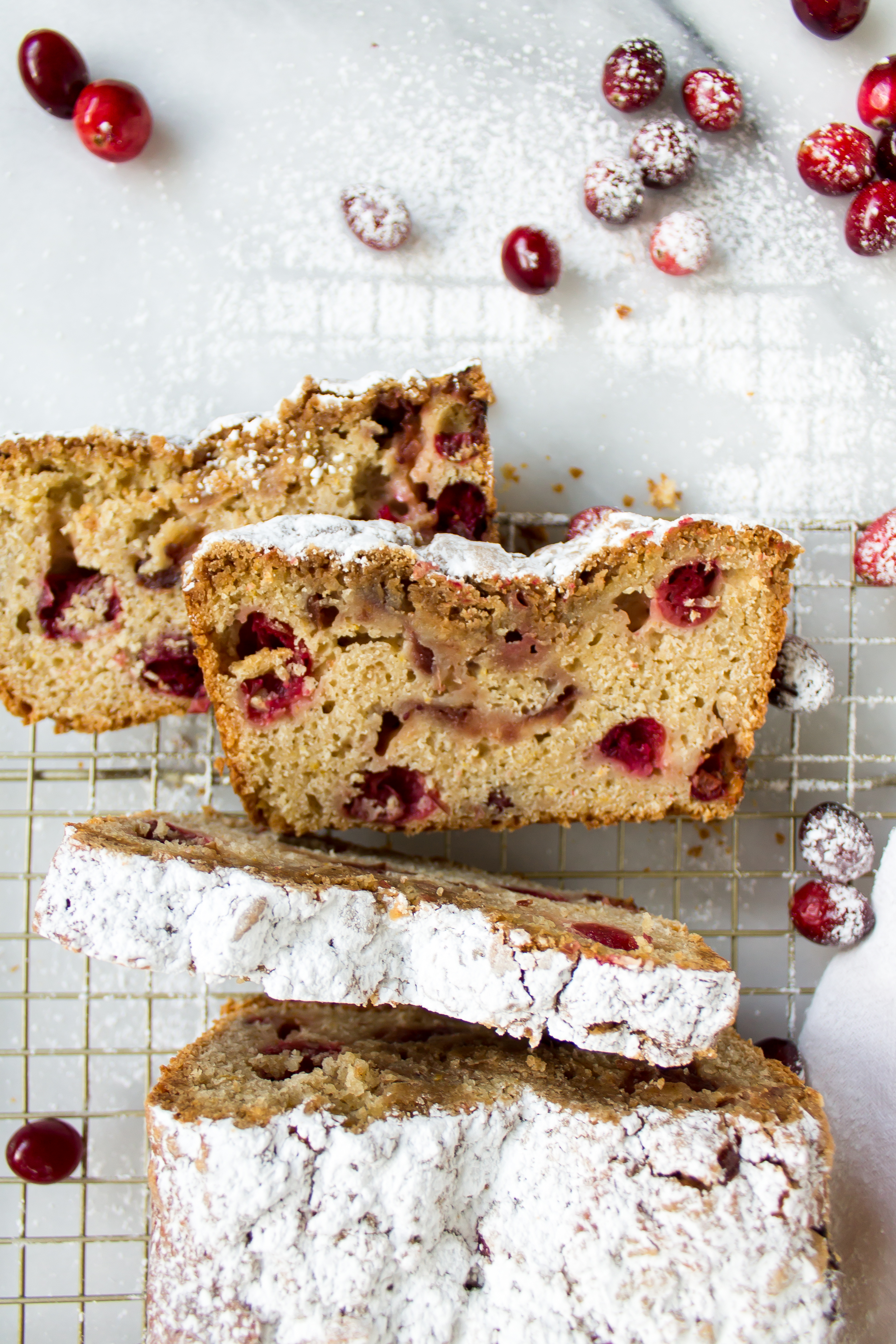 Cranberry quick bread is the perfect double duty bread! Make it for breakfast on Thanksgiving morning or use your leftover cranberry sauce to make a loaf for post-Thanksgiving enjoyment. | www.passthecookies.com