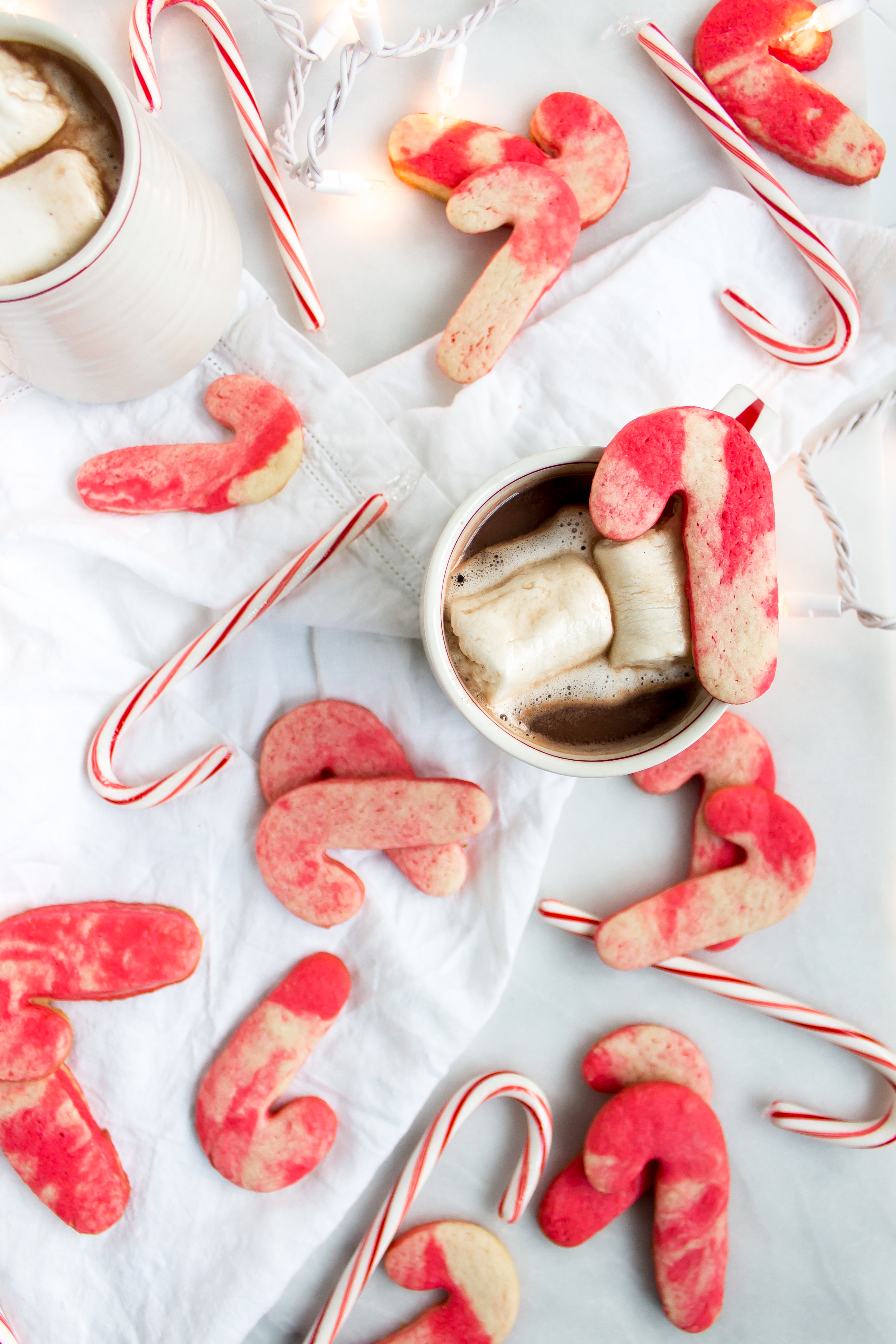 Marbled peppermint sugar cookies are a fun holiday treat and a staple in our Christmas cookie boxes. The marbling is so pretty that they don't even require royal icing or extra decorating, leaving more time for all of your other holiday activities! | www.passthecookies.com