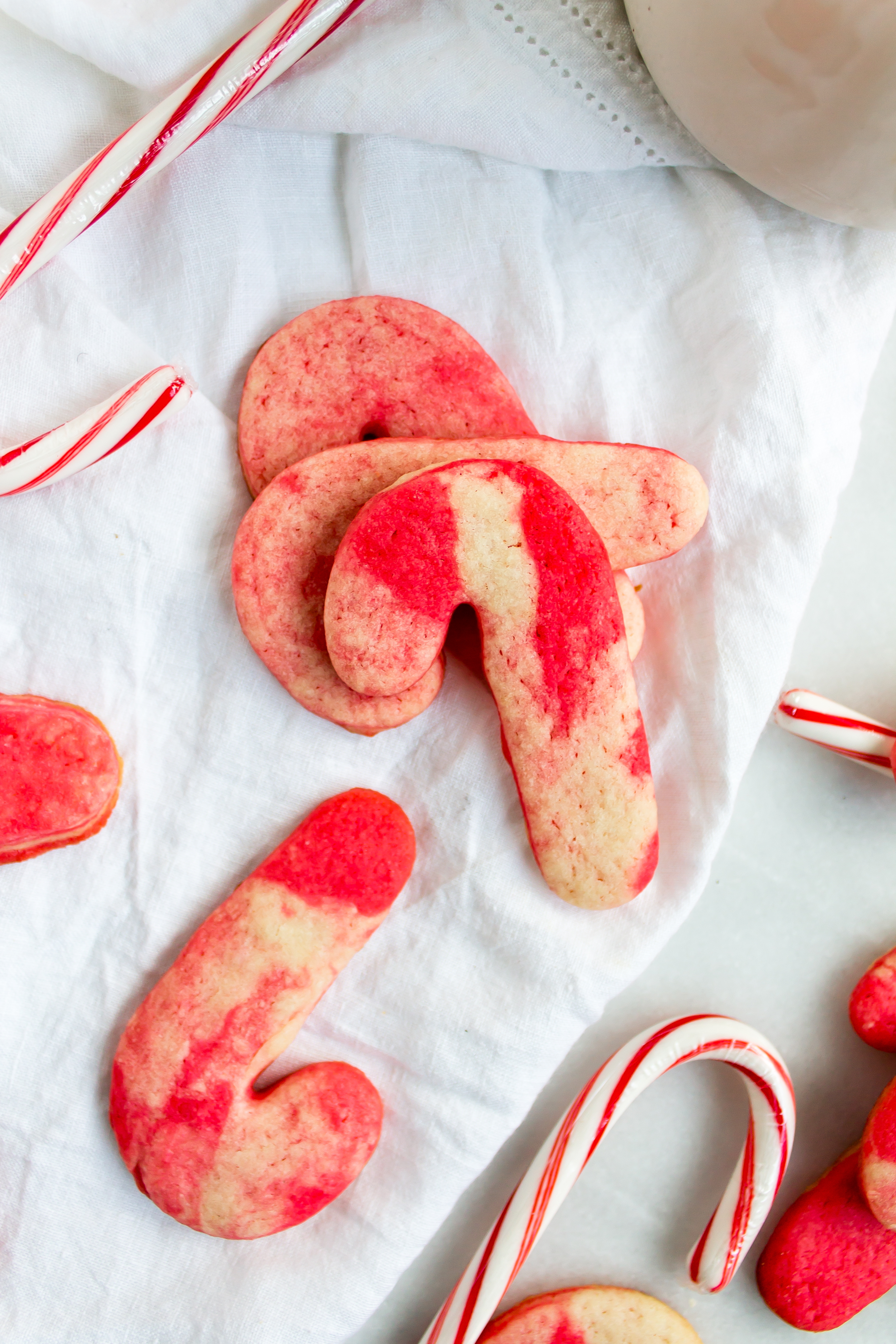 Marbled peppermint sugar cookies are a fun holiday treat and a staple in our Christmas cookie boxes. The marbling is so pretty that they don't even require royal icing or extra decorating, leaving more time for all of your other holiday activities! | www.passthecookies.com