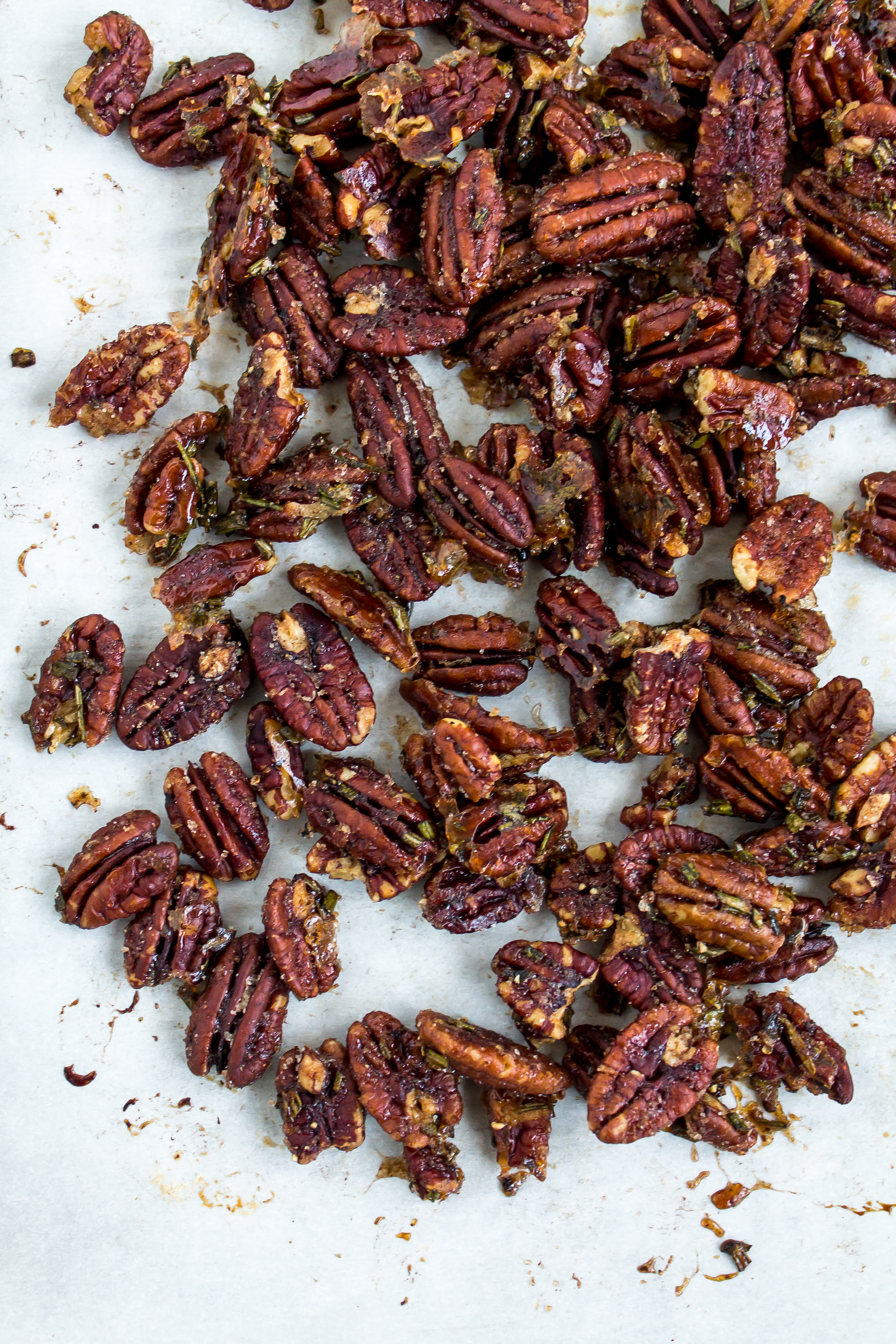 Rosemary spiced pecans are the perfect sweet and salty snack for your appetizer board. With their deliciously addictive flavor, everyone will ask you for this recipe. | Pass the Cookies | www.passthecookies.com