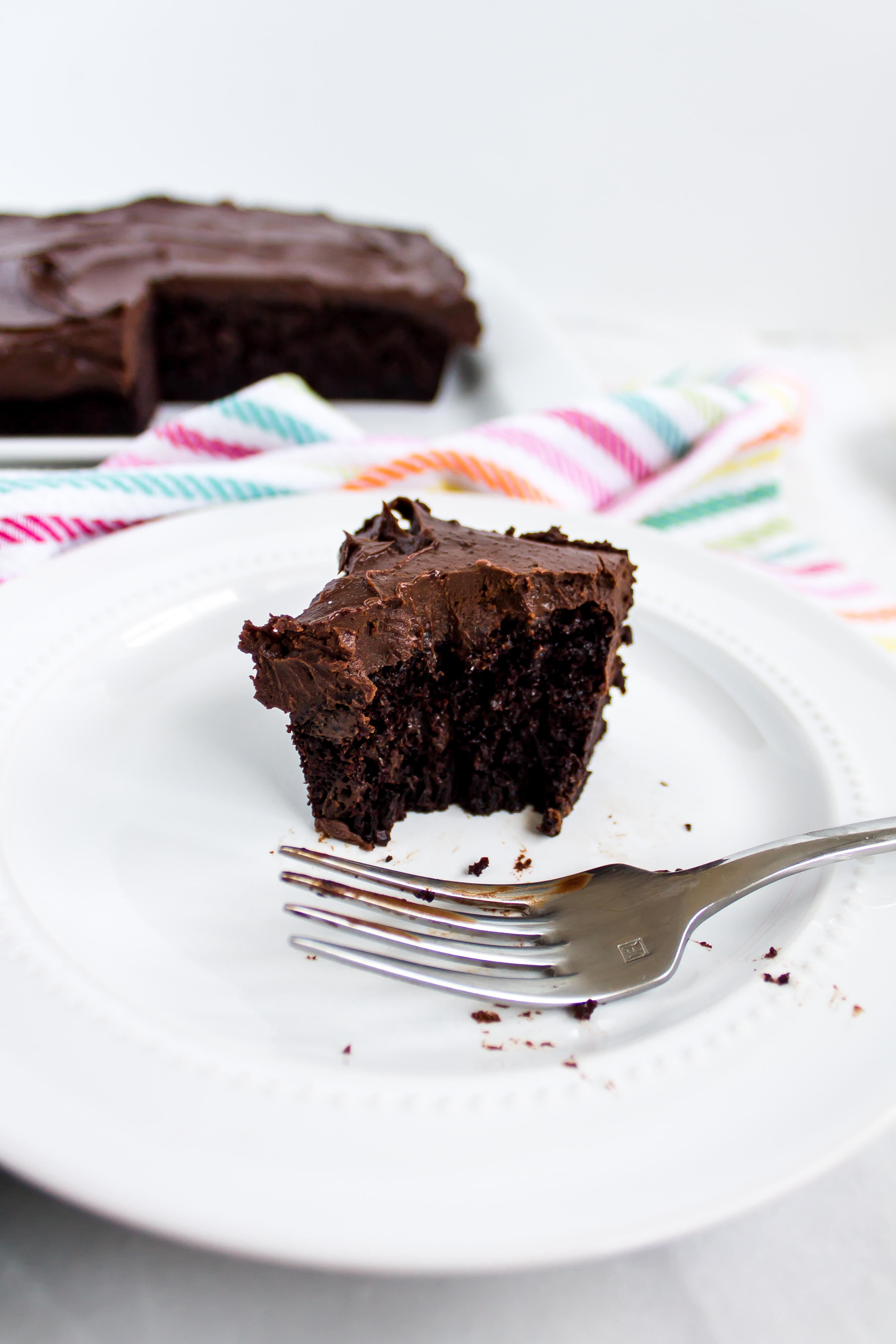 One bowl whiskey chocolate cake with decadent Irish cream chocolate ganache frosting is the perfect snack cake for St. Patrick's Day, or just your next picnic. It is easy and sure to be a crowd pleaser. | www.passthecookies.com