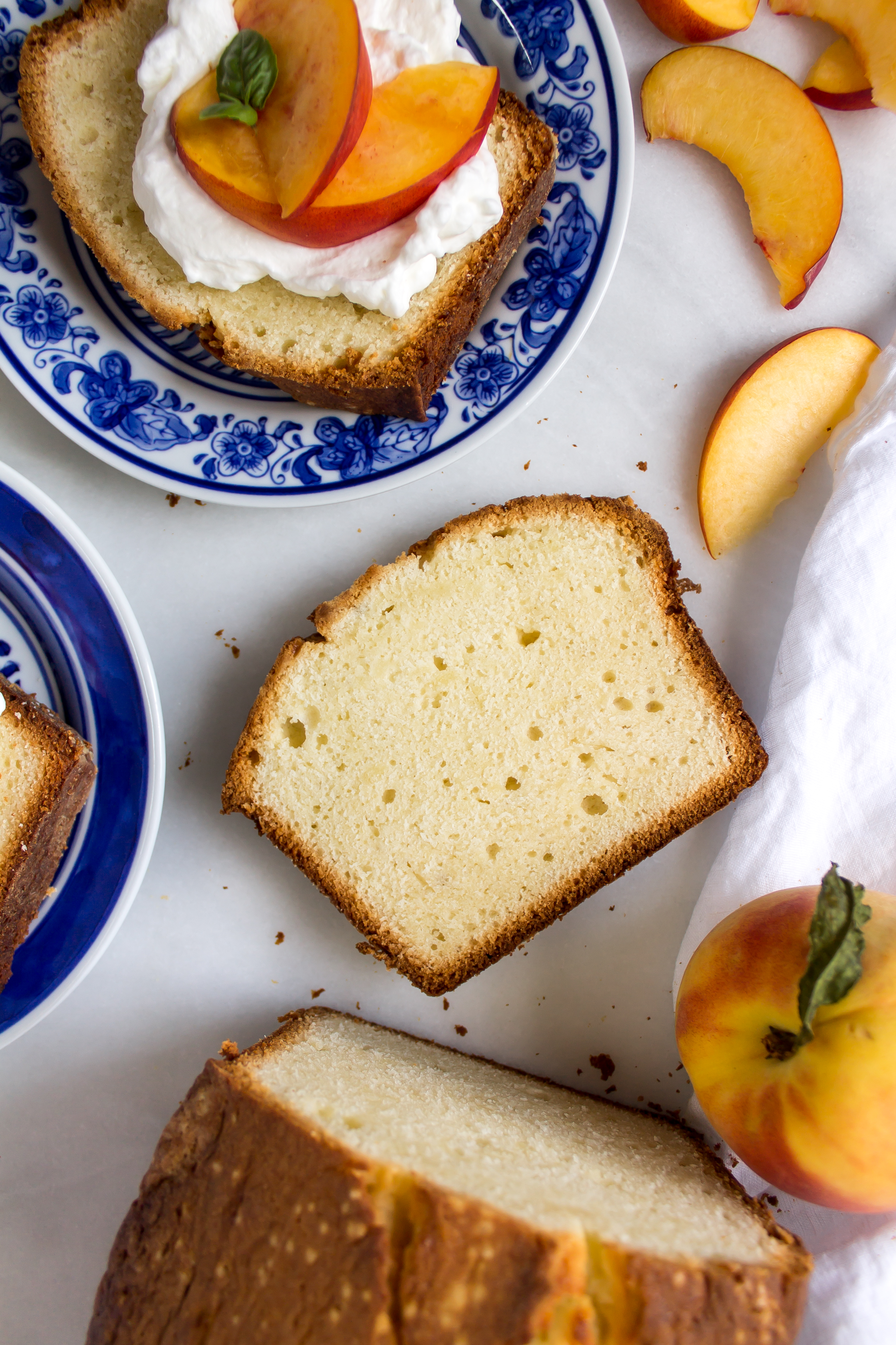 Greek yogurt almond pound cake is the perfectly simple dessert you need to showcase your delicious summer fruit. | www.passthecookies.com