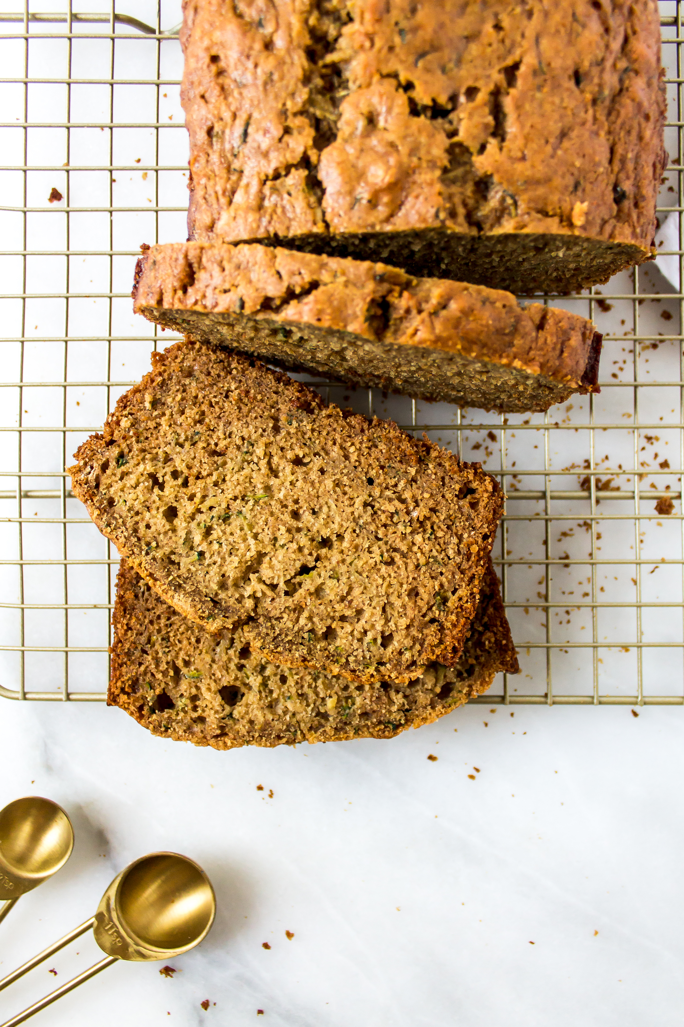 One-bowl healthy zucchini bread is an easy breakfast or afternoon treat. By the taste, you would never know it is filled with veggies! | Pass the Cookies | www.passthecookies.com