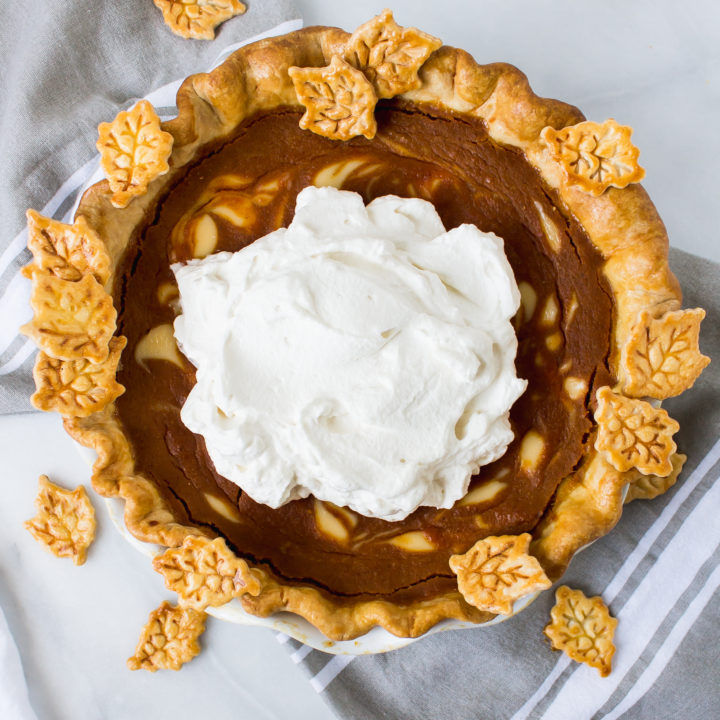 Buttermilk bourbon pumpkin pie has the smooth and custardy pumpkin we all know, with a little tang from buttermilk and creme fraiche. Make it throughout the fall, or display it on your Thanksgiving table. | Pass the Cookies | www.passthecookies.com
