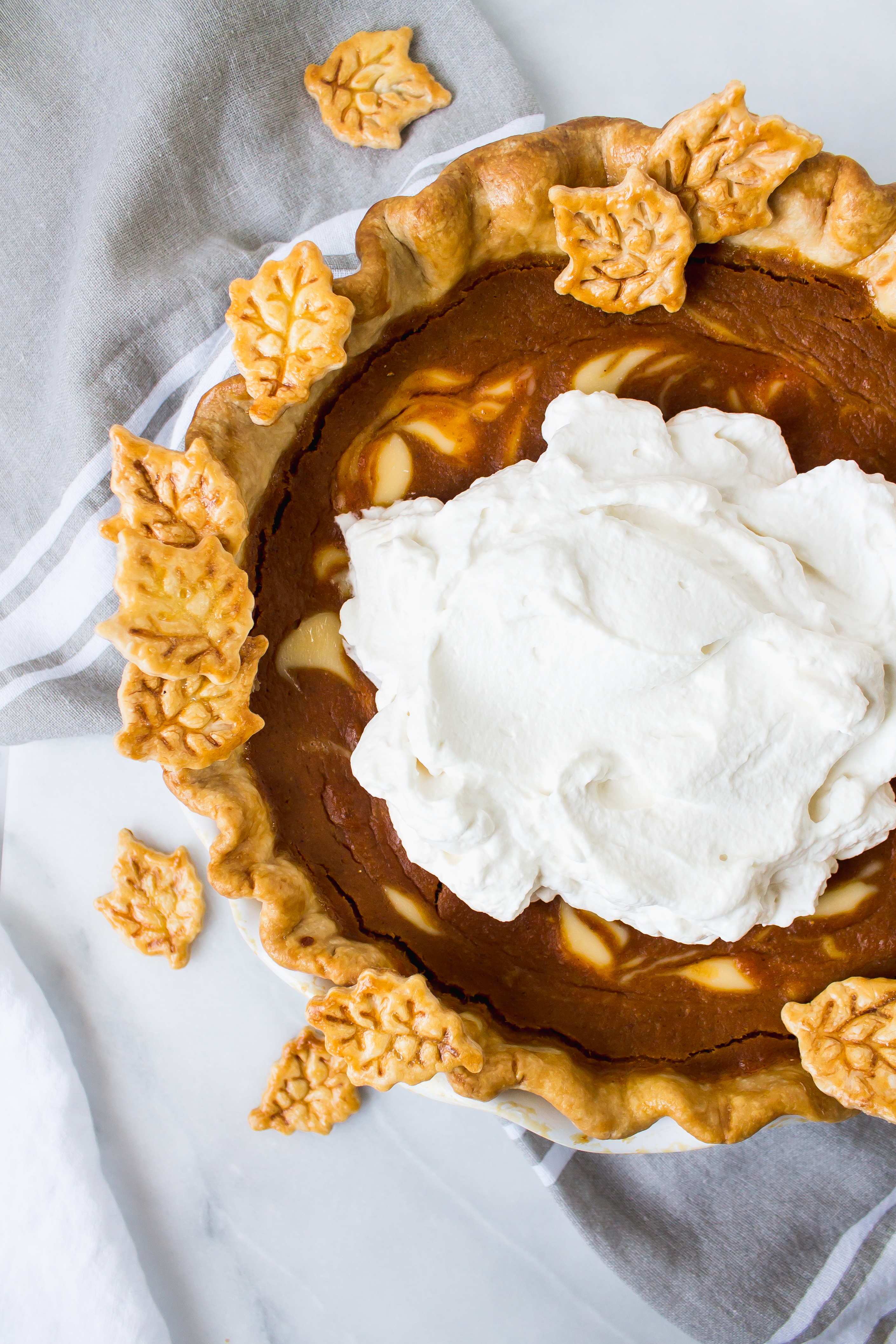 Buttermilk bourbon pumpkin pie has the smooth and custardy pumpkin we all know, with a little tang from buttermilk and creme fraiche. Make it throughout the fall, or display it on your Thanksgiving table. | Pass the Cookies | www.passthecookies.com
