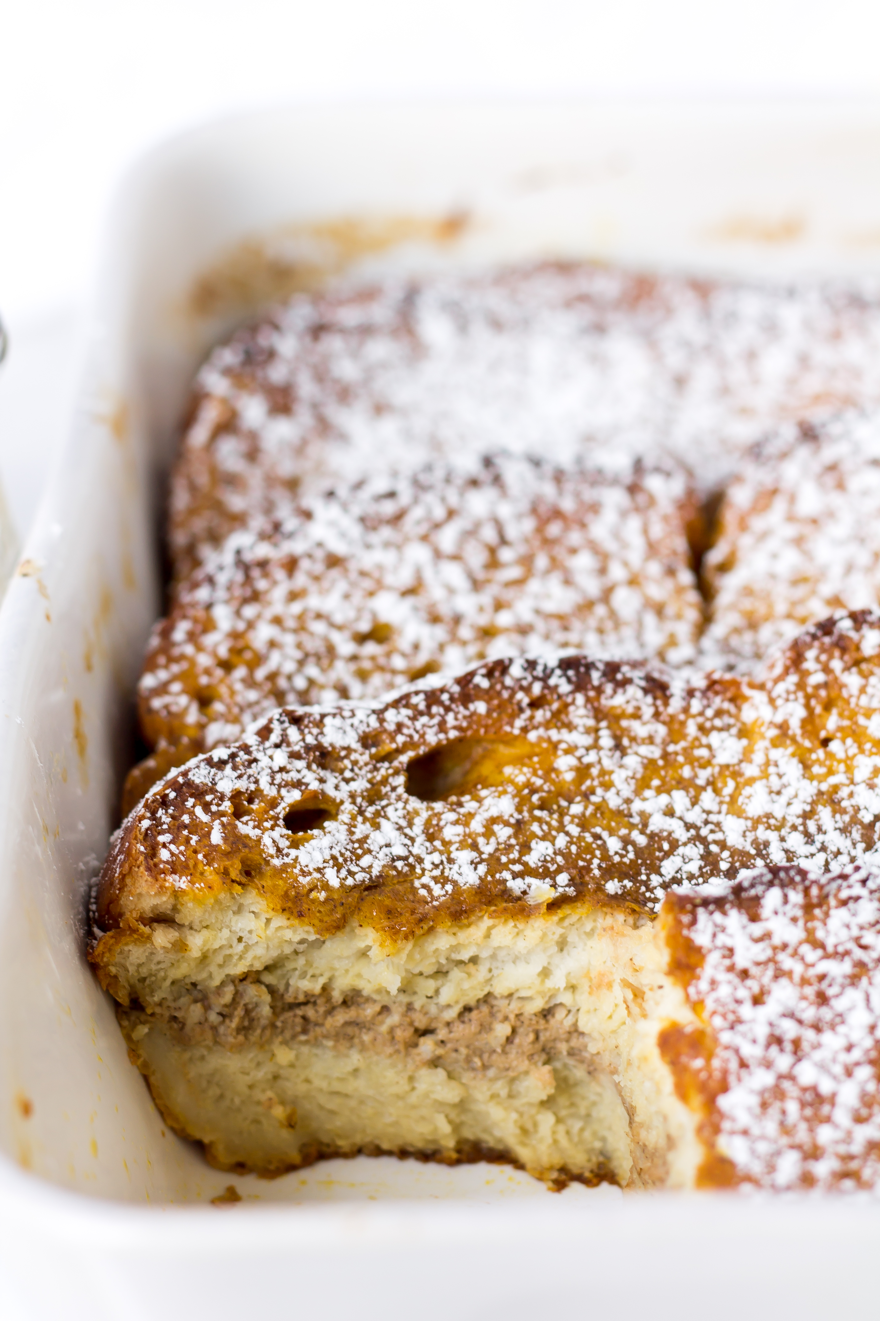 Pumpkin French toast casserole is easy to make ahead and warm up for a cold morning at home. It is almost custard-like and the apple cider syrup shouldn't be missed! | Pass the Cookies | www.passthecookies.com