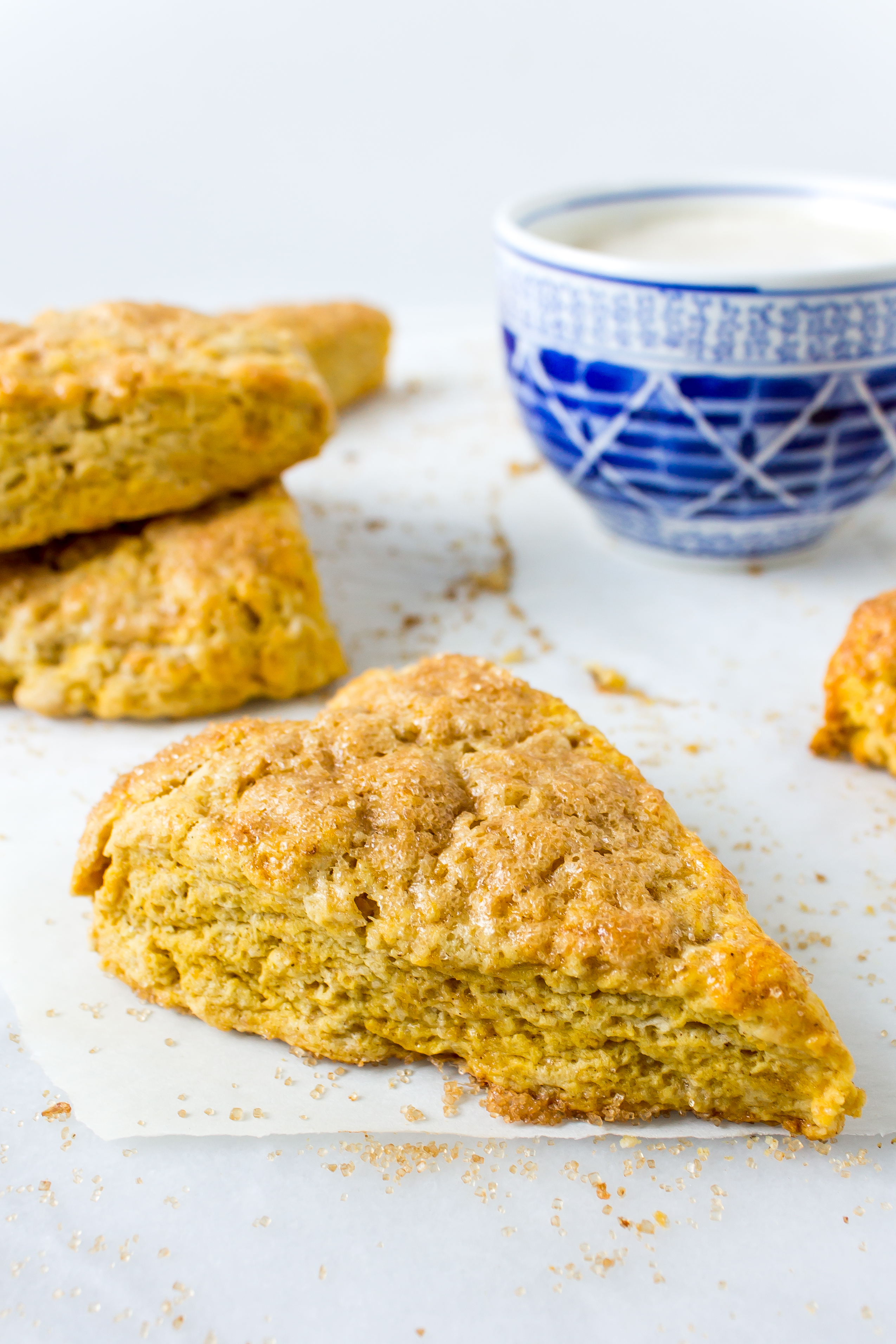 Fluffy, buttery pumpkin scones make the perfect pairing to your coffee on those crisp fall mornings. | Pass the Cookies | www.passthecookies.com